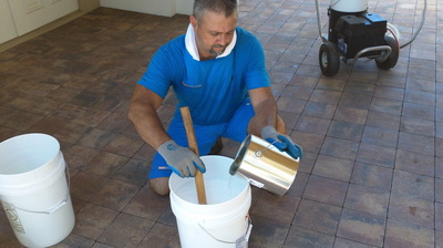 Jeff Evers mixing paver sealant