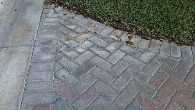 sidewalk in need of paver restoration